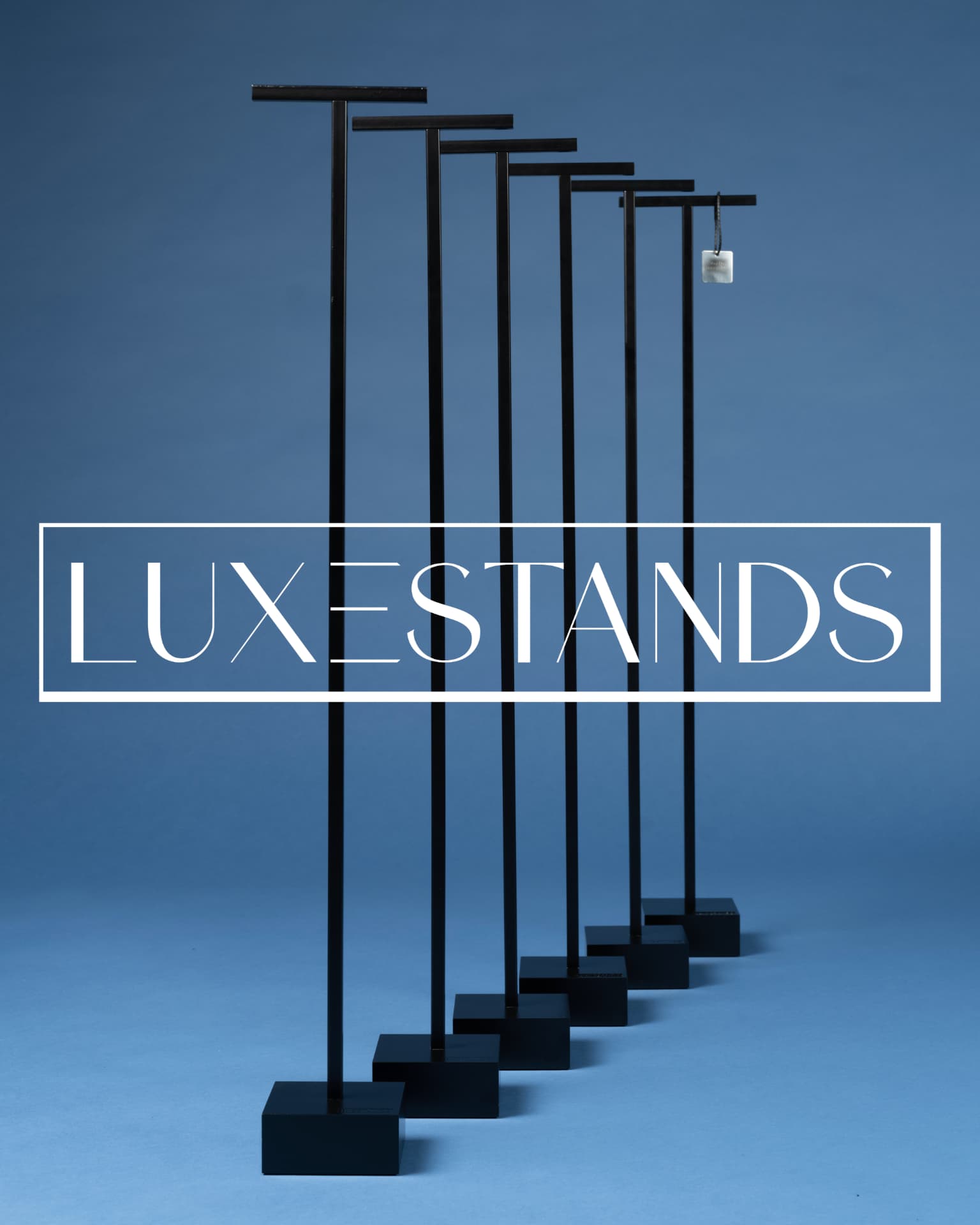 Six Luxestands arranged in a receding row with the Luxestands wordmark across the frame.